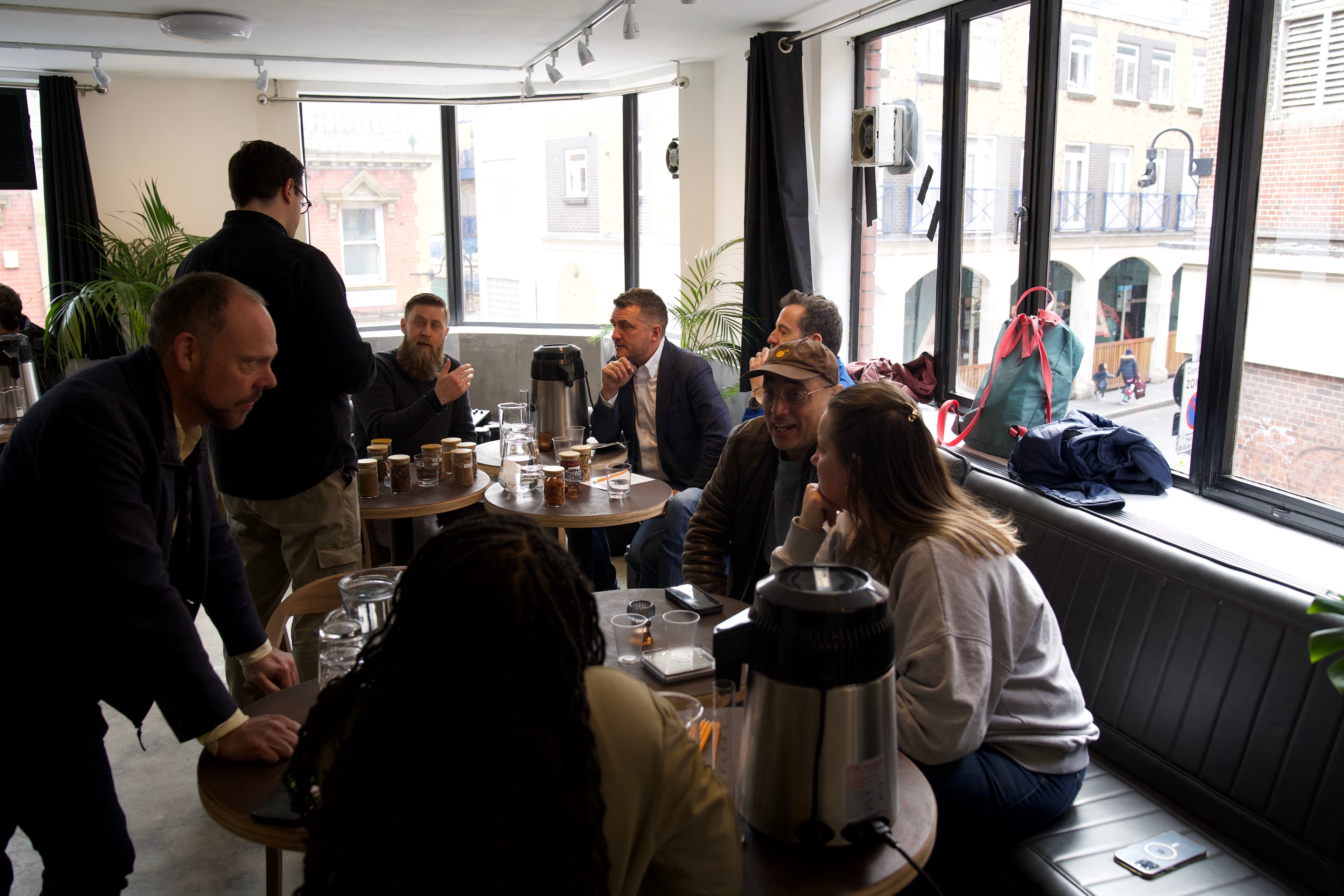 A Make Your Own Rum session at the BCC Distillery — guests at the blending tables in the Brixton Village room, Village visible through the windows
